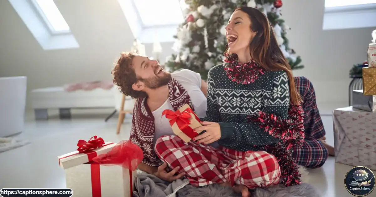 Couple in mismatched Christmas pajamas laughing while exchanging holiday gifts.